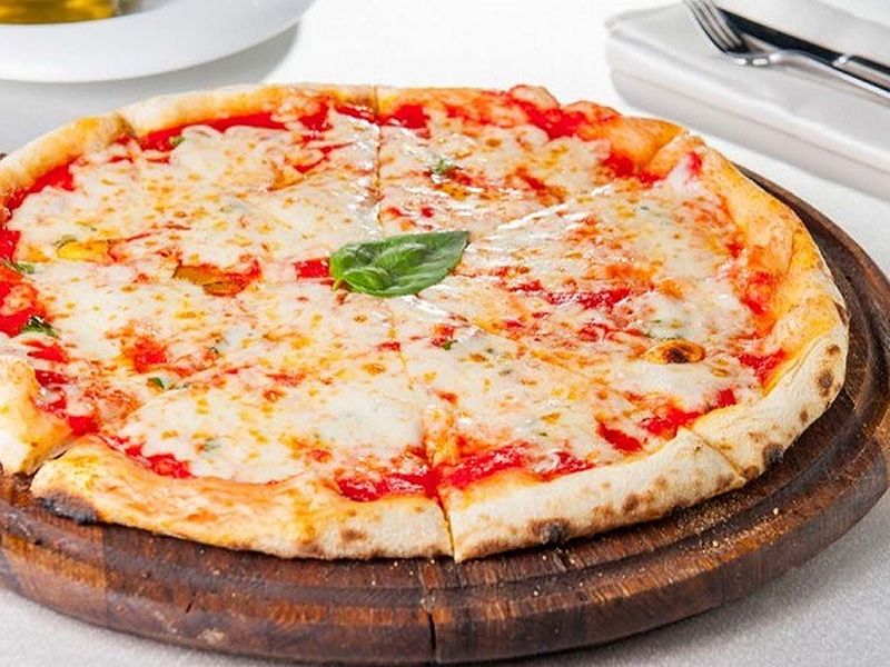 Pizza with sauce and mozzarella cheese