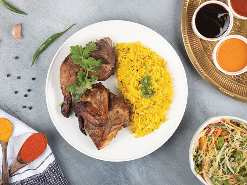 Quarter Chicken Breast With Rice And Appetizers