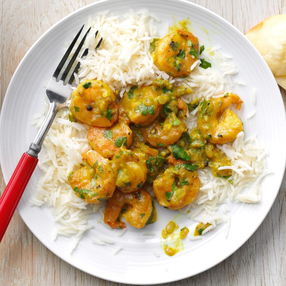 Shrimp in curry sauce with white rice and vegetables