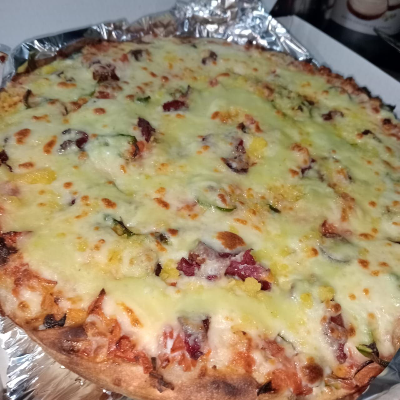 Oriental sausage pizza