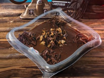 Pudding With Ice Cream And Nuts And Chocolate Sauce