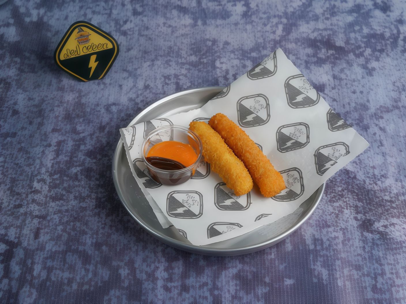 2 Cheddar Cheese Sticks And Cup Of Sauce