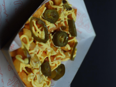 Medium French Fries With Jalapeno Pepper And Cheddar Cheese Sauce