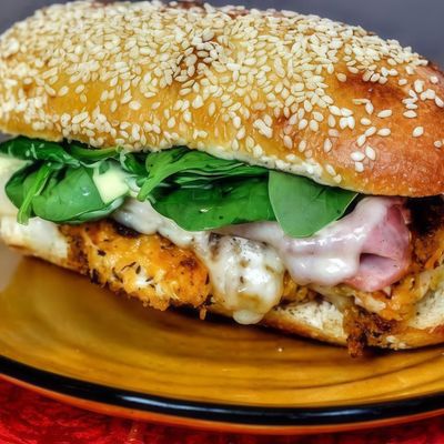 Chicken Cordon Bleu Sandwich with French Fries.