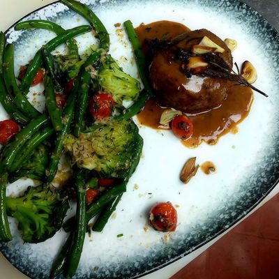 Meat Fillet With Rosemary Sauce And Garlic Platter