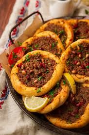 Kilo of meat with tomato on dough