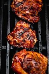 Quarter chicken breast grilled on charcoal