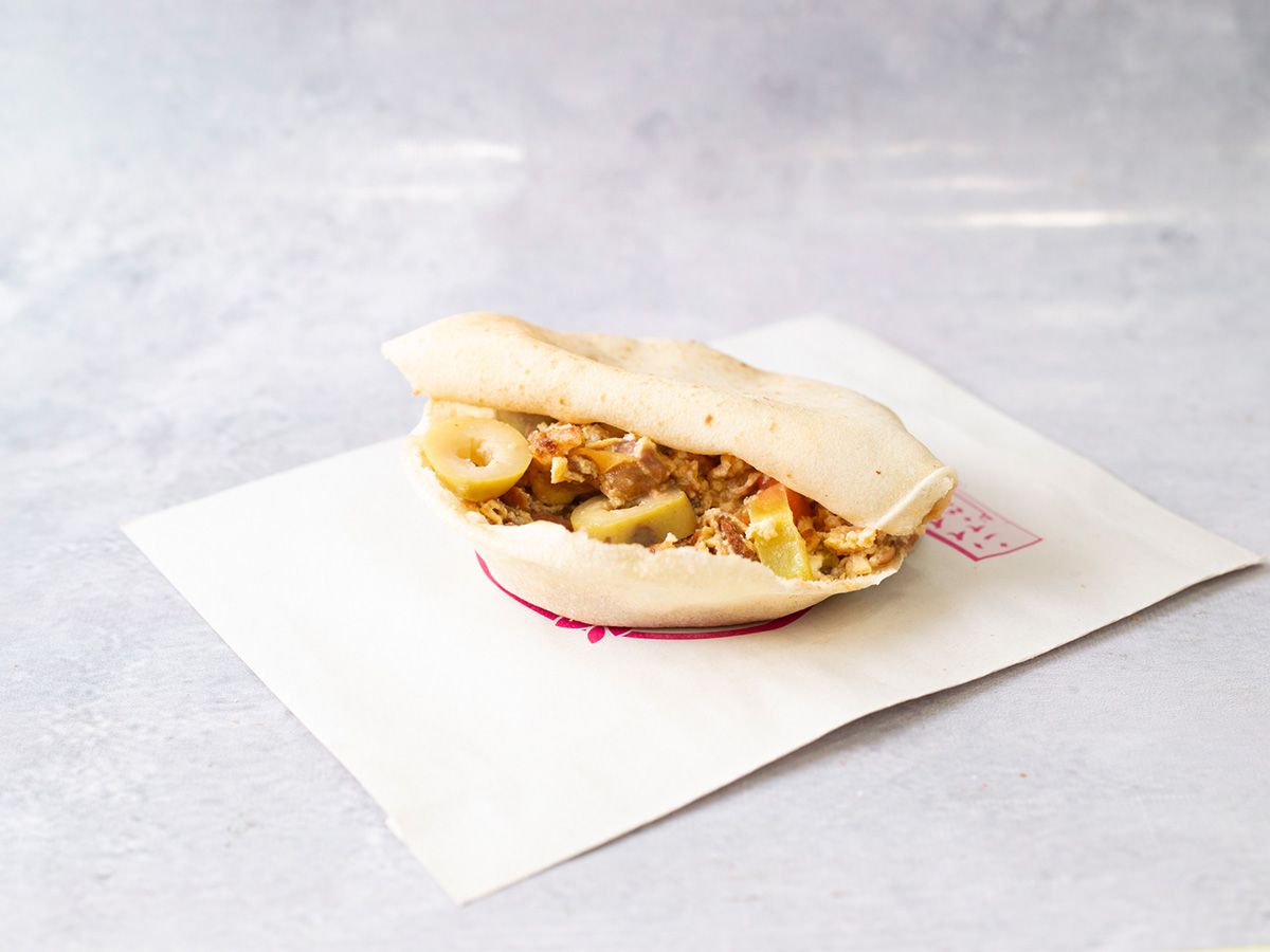 foul with eggs and pastrami sandwich