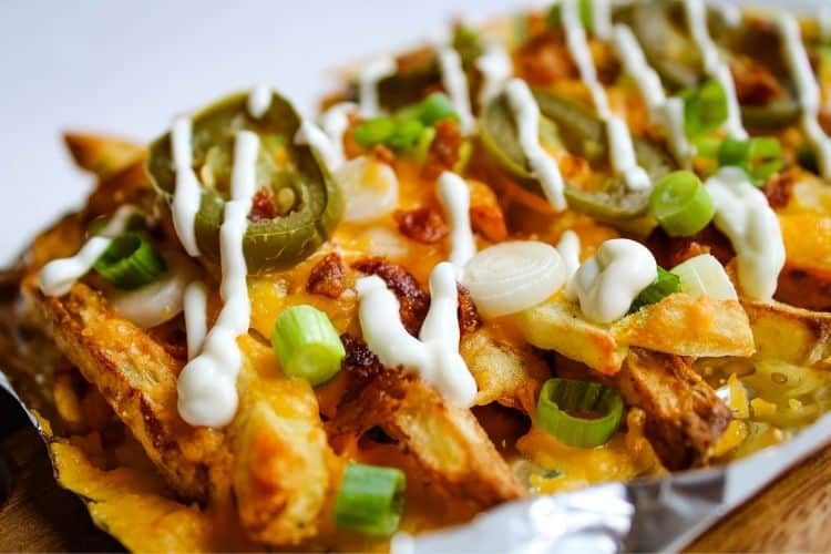 French Fries With Cheese And Jalapeno Sauce