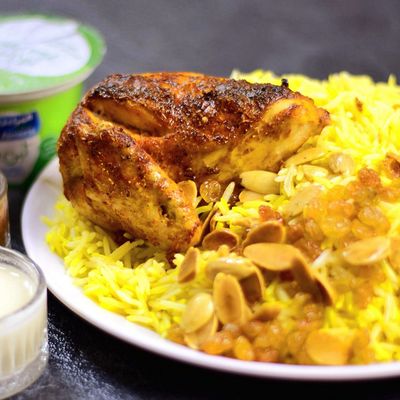 half Mandi chicken with rice and spicy Daqoos