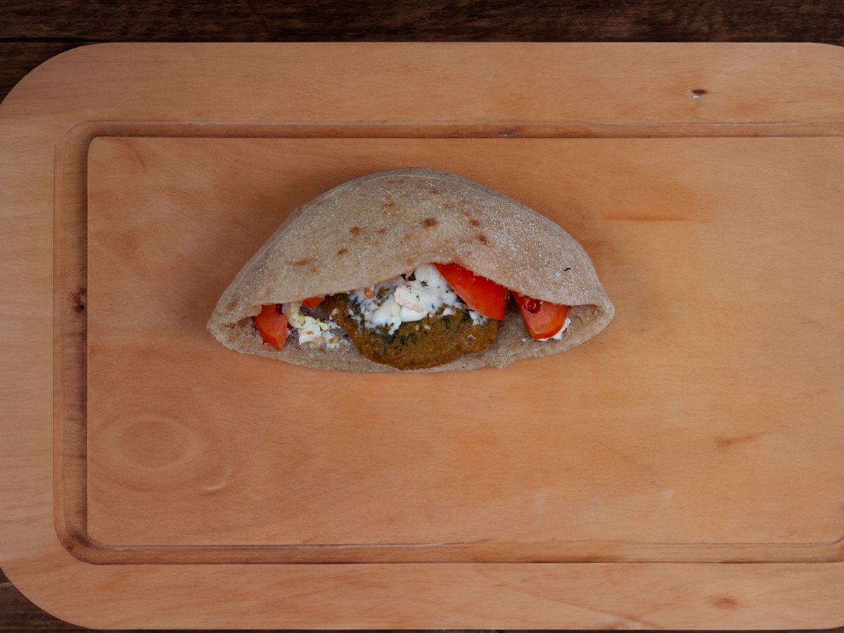 Falafel sandwich with feta cheese and tomato