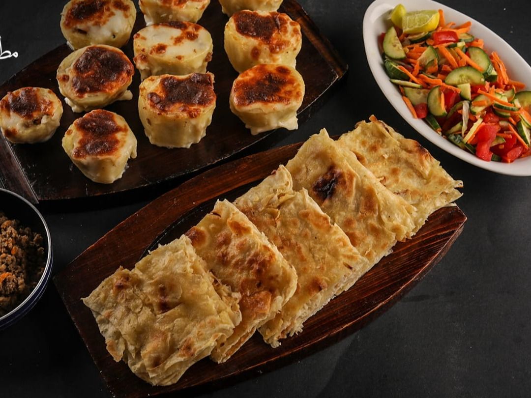 Offer Tray Of Potatoes Stuffed With Minced Meat Bechamel And Tortillas With Minced Meat