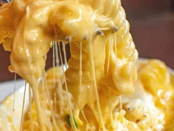 Pasta With Chicken Strips And Cheddar Sauce.