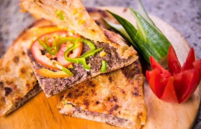 Bread with pastrami and cheese