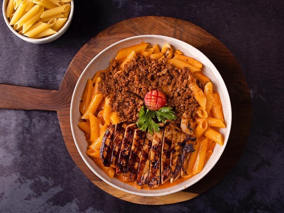 Zozo Pasta Served With Grilled Chicken Breast And Mix Cheese Sauce