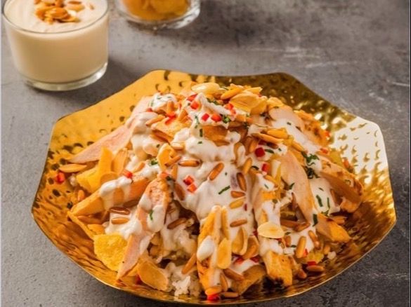 Lebanese fatteh with chicken and pine nut