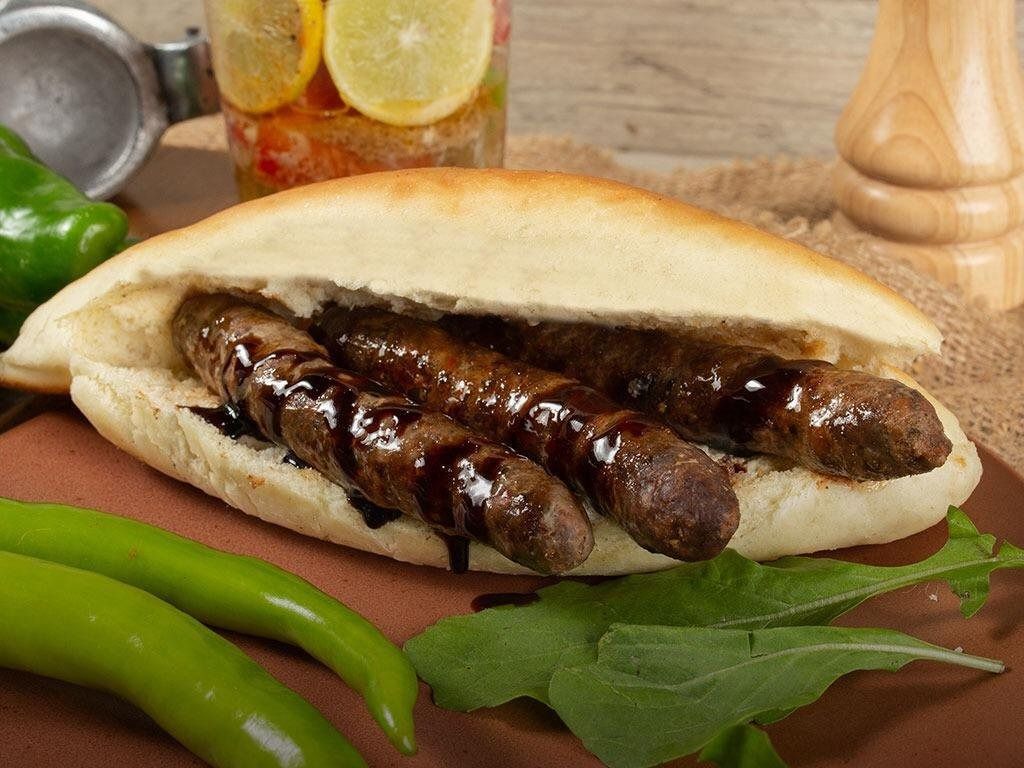 Grilled sausage pomegranate molasses sandwich
