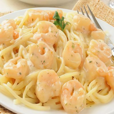 Seafood pasta with white sauce and mozzarella cheese