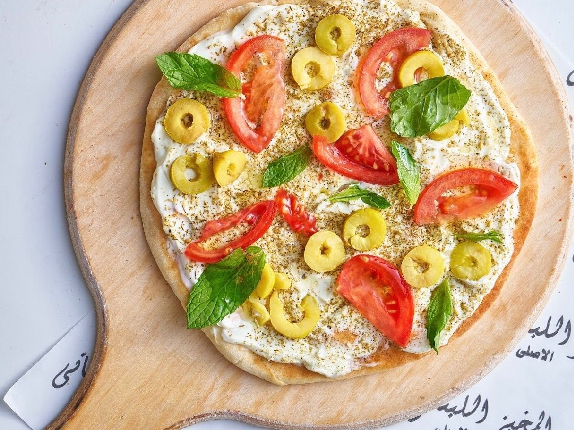 Labneh with Zaatar and vegetables manoushe