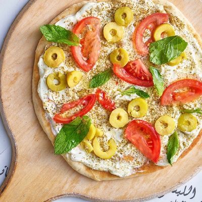 Labneh with Zaatar and vegetables manoushe