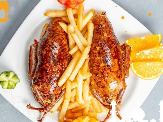 2 stuffed pigeon with rice and potatoes