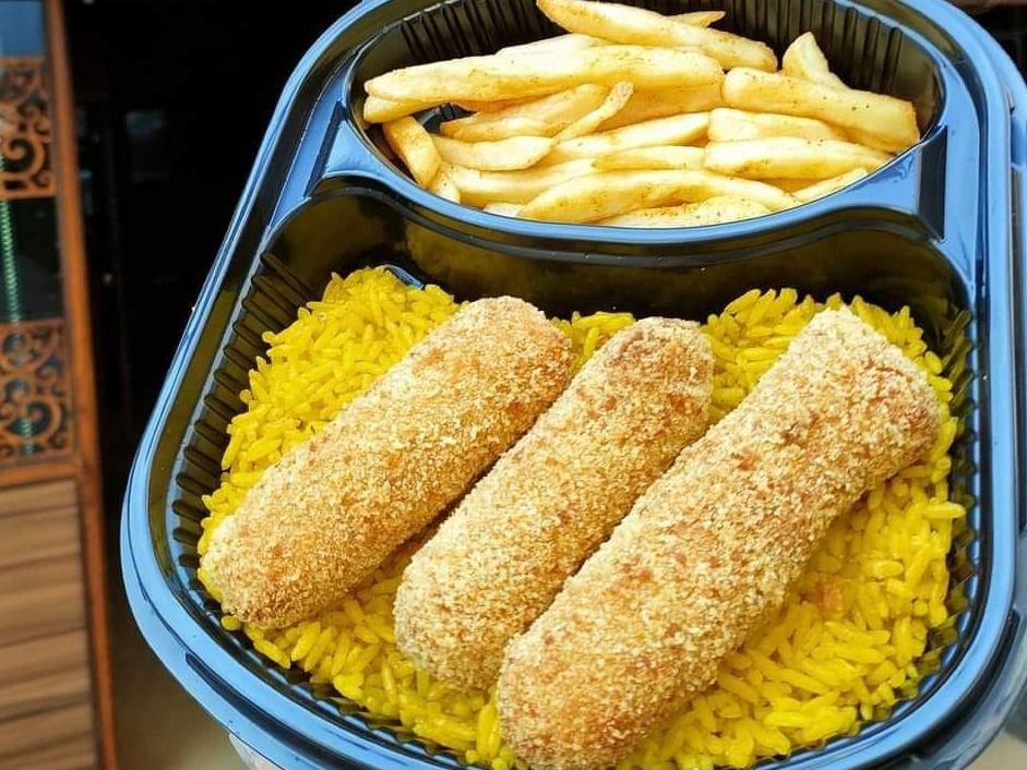 Cordon Bleu Meal With French Fries And Spiced Rice