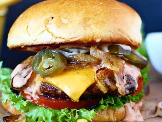 On Fire Texax Beef Burger Sandwich Stuffed With Cheese With Jalapeno