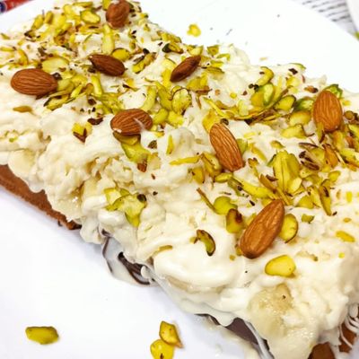 Waffle with chocolate, cream qeshta, and nuts
