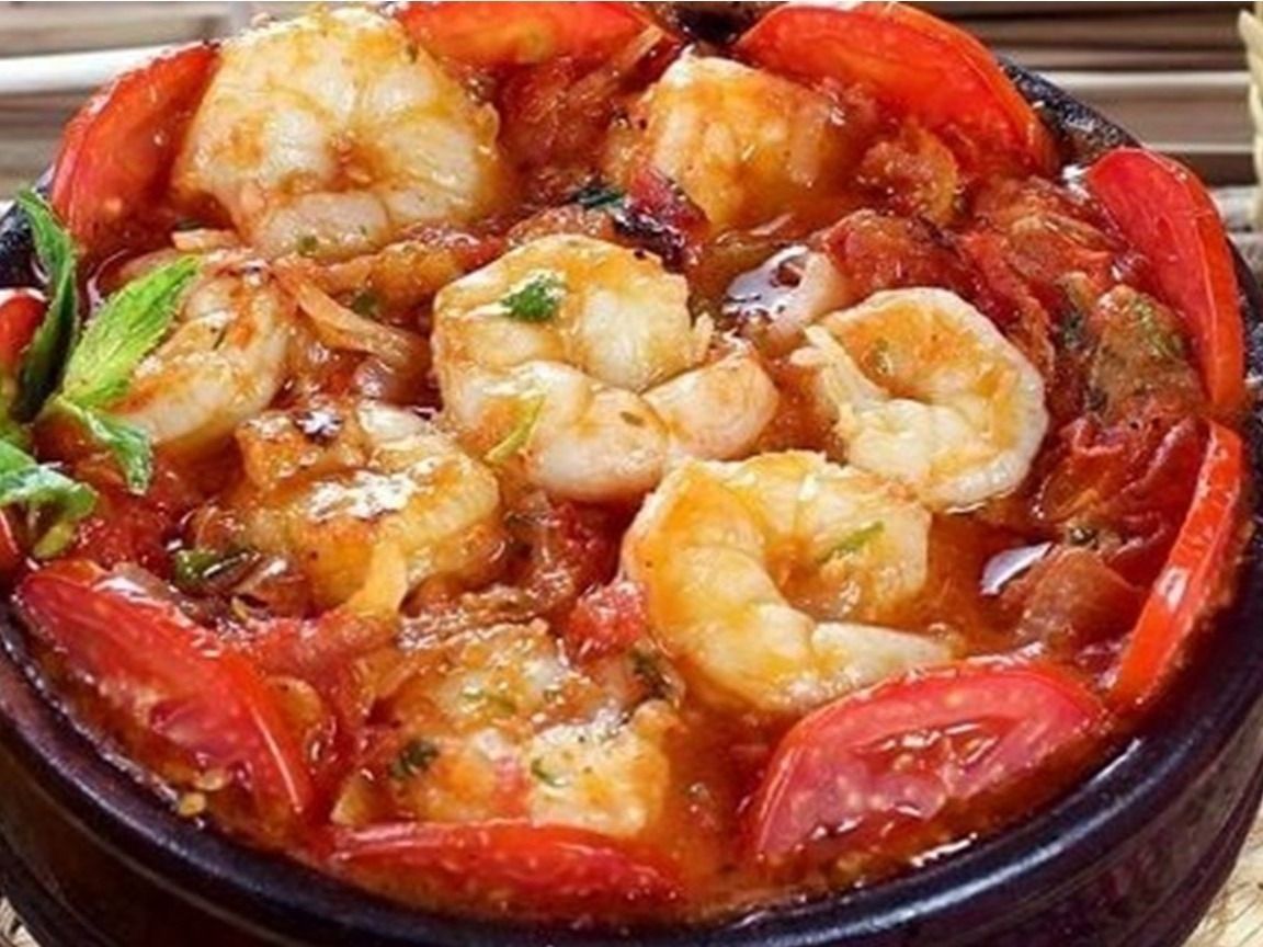 Casserole Of Peeled Shrimp And Meat With Red Sauce