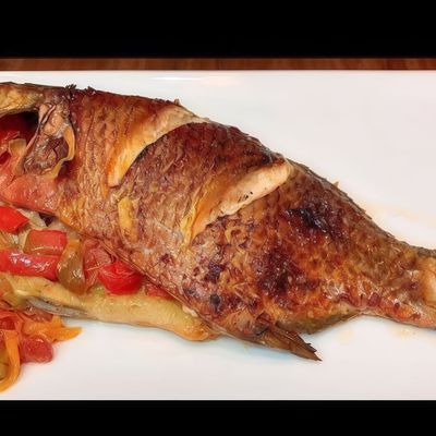 Grilled local tilapia with oil and lemon