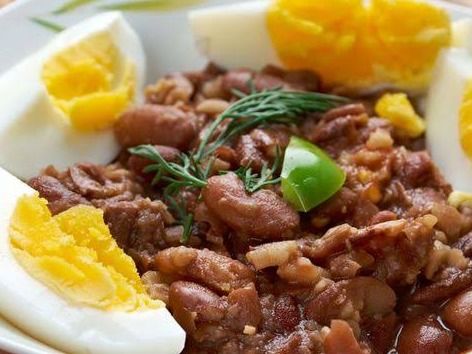 Foul with boiled eggs pan
