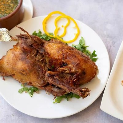 Half duck with rice and molokhia