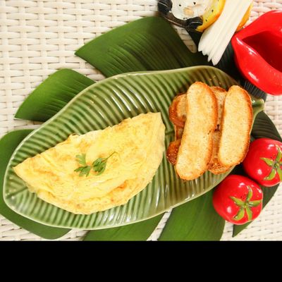 Plain Omelet Served With Bread Slices