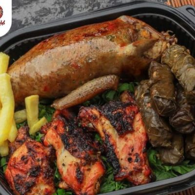 A Meal Of Pigeons, Chicken, Grape Leaves, And Potatoes