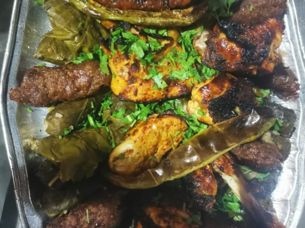 6 Pieces Of Chicken, 6 Pieces Of Kofta, 9 Pieces Of Sausage, Grape Leaves, Salad And Bread
