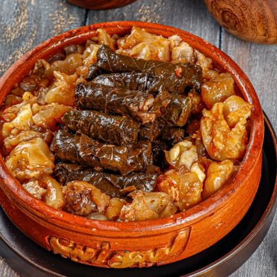 Knuckles With Vine Leaves And Onions