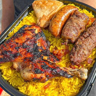 A Quarter Chicken Meal, A Piece Of Kofta, A Piece Of Tarb, A Piece Of Mombar, A Piece Of Sambousek, And Basmati.