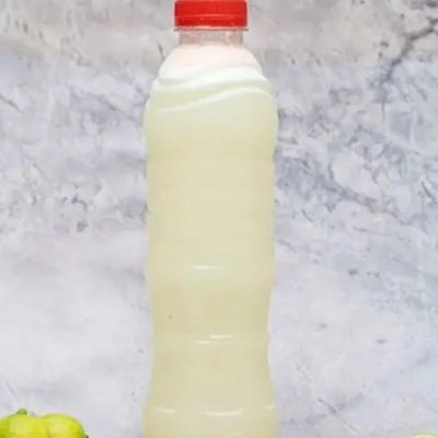 Bottle Of Sugarcane Juice On Lemon