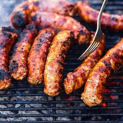 Grilled sausage, salad, tahini and bread