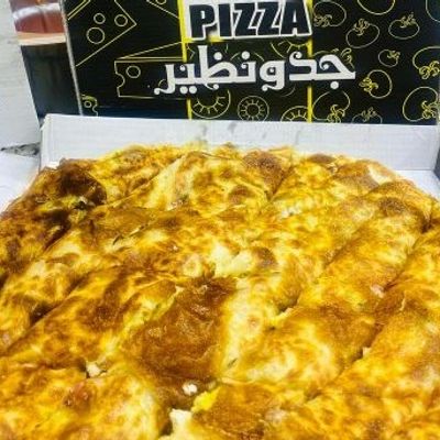Half pastrami and half sausage pie