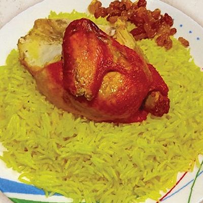 Quarter Biryani chicken with rice and sauce