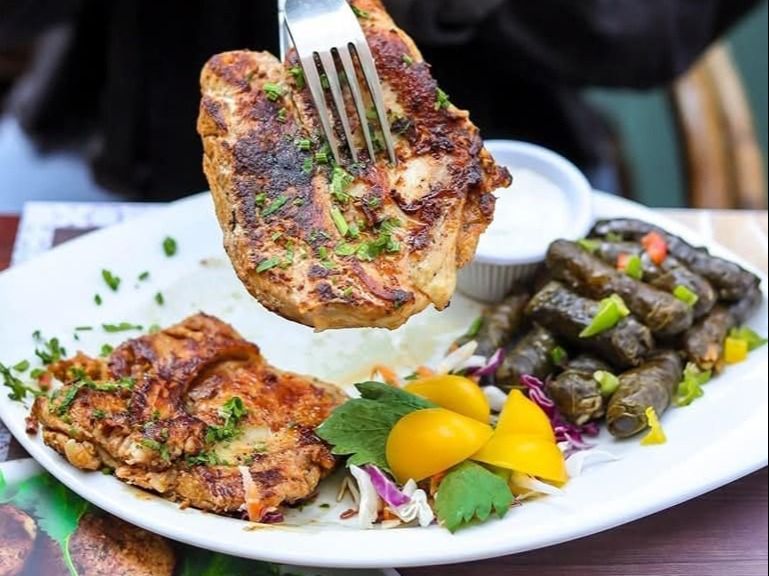 Half chicken with Mahshi Vine Leaves