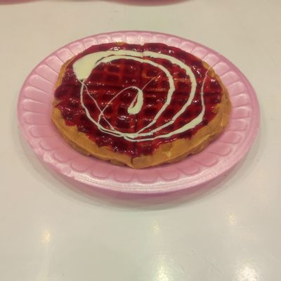 Waffle with strawberry sauce