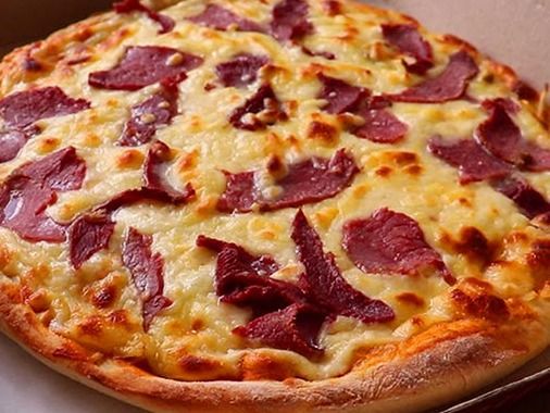 Italian pizza with pastrami and Kiri cheese