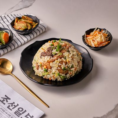 Fried Rice Mixed Chicken, Meat, And Seafood Served With Special Korean Appetizers.