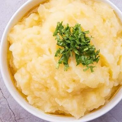 Box of mashed potatoes with butter