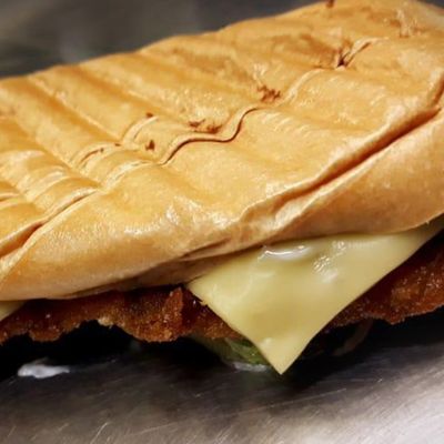 Breaded Chicken Pane with Cheddar Cheese Sauce