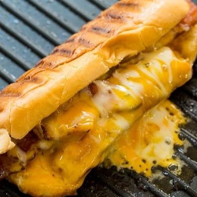 Hot dog with cheddar sauce