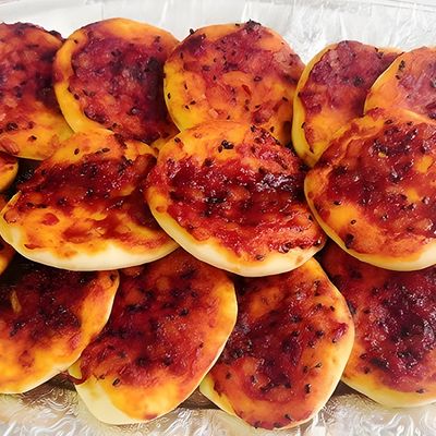 Red Manoucheh Pastries With Red Sauce