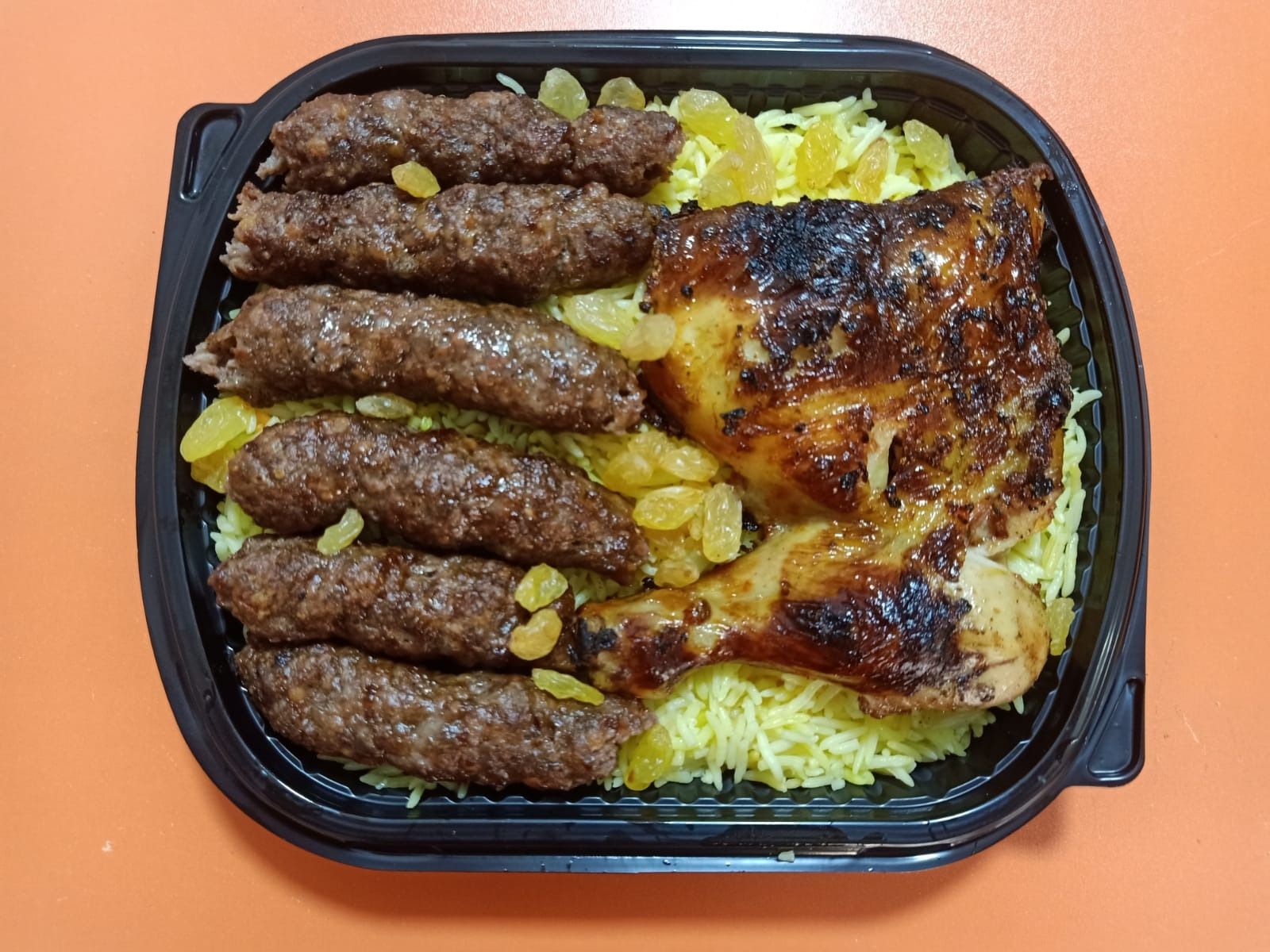 A Quarter Kilo Of Kofta With A Quarter Of Grilled Chicken And Rice